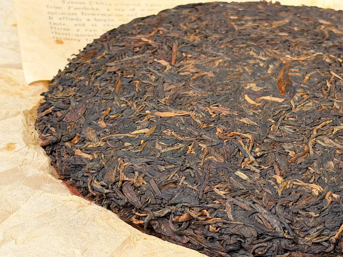 Late 1980s Menghai 7542 "88 Qingbing" Thin Paper Raw Puerh Cake